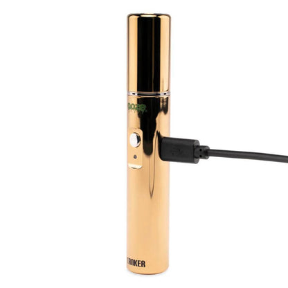 Ooze Tanker 510 battery in gold charging via USB, showcasing sleek design and functionality for superior vaping.