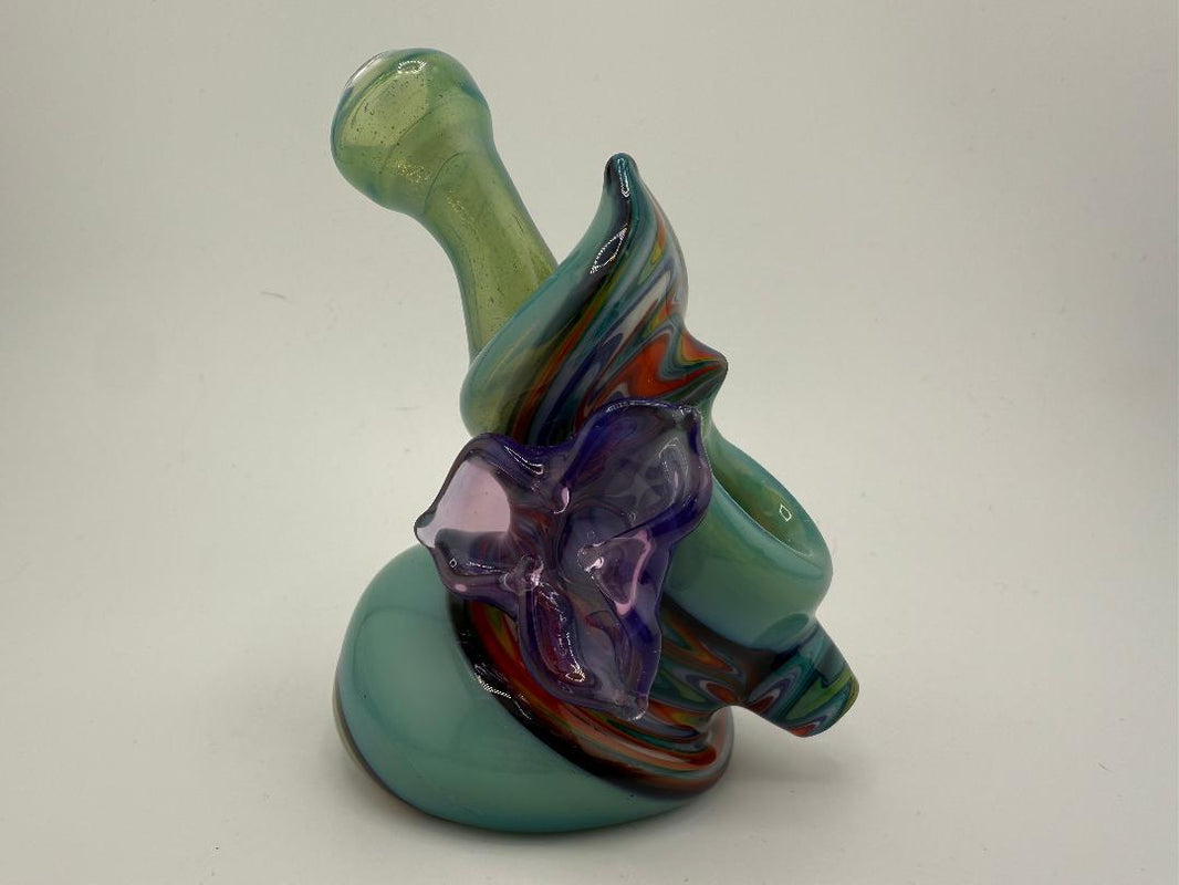 Highgrade Glass Reversal Squatlock Pipe showcasing vibrant colors and unique spiral design in a compact form.