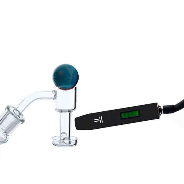 Terpometer IR thermometer next to a glass banger, showcasing precision temperature control for dabbing.