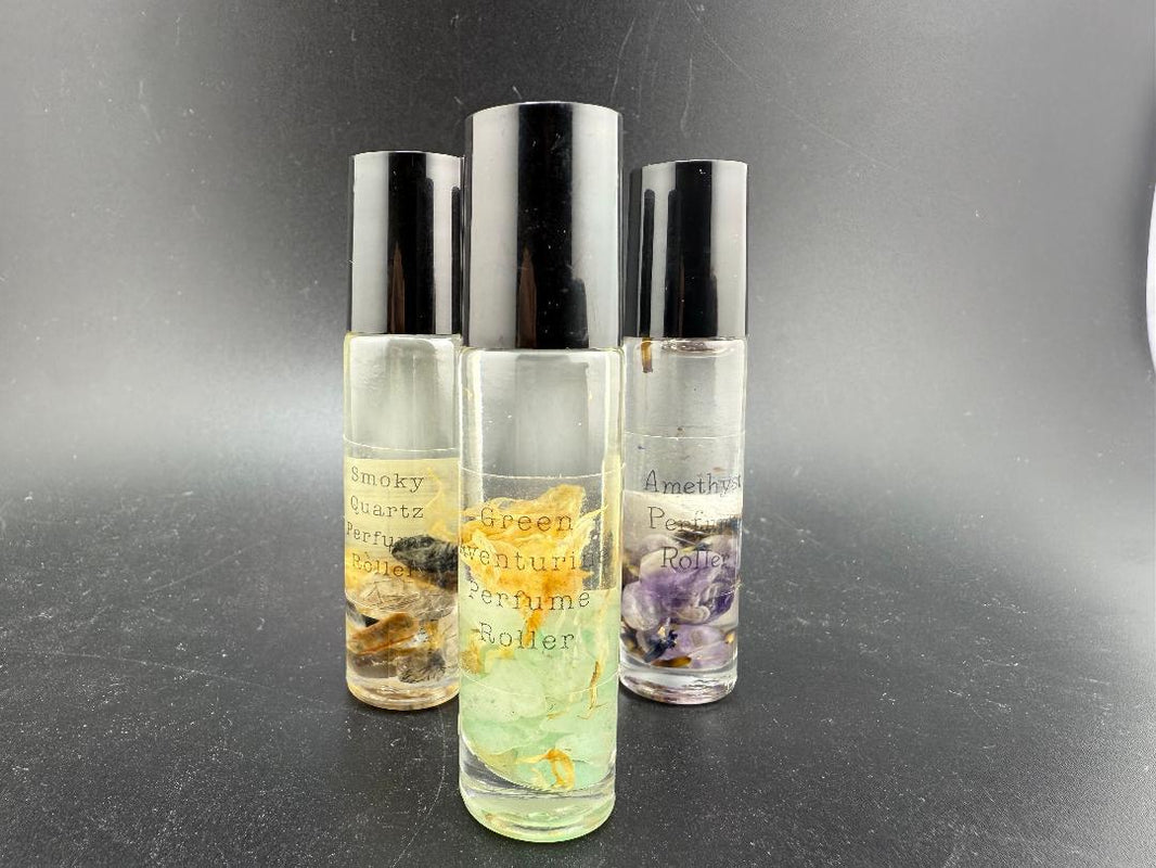 Crystal Perfume Rollers with gemstone rollerballs showcasing Smoky Quartz, Green Aventurine, and Amethyst scents.