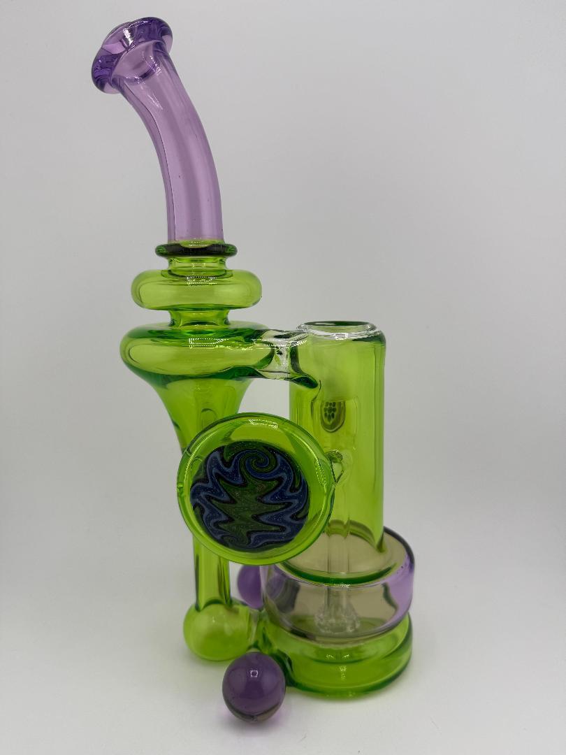 Crondo Glass Green and Purple RBR Shaped Recycler with a 14mm 90° joint, showcasing unique colors and design for enhanced sessions.