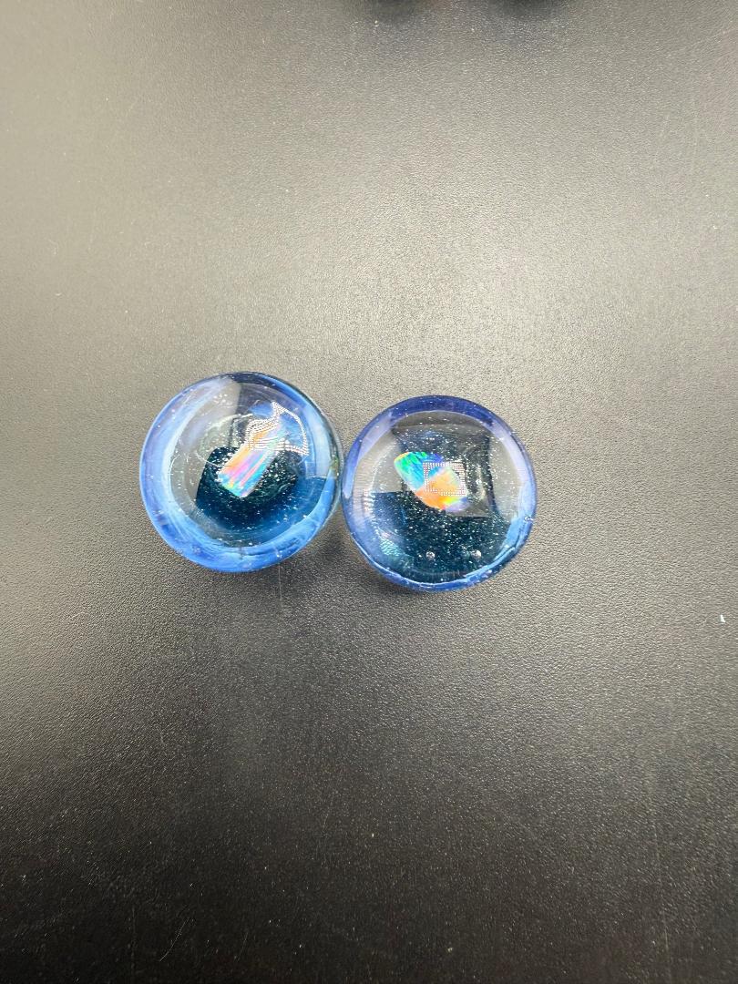 Mop Head Glass Gauges in 15/16" size, showcasing blue artisan glass with unique swirl textures.