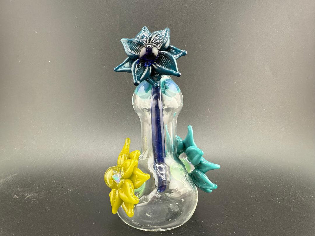 Pablos Glass Flower Jar featuring vibrant glass flowers in blue and yellow, perfect for decorative use.