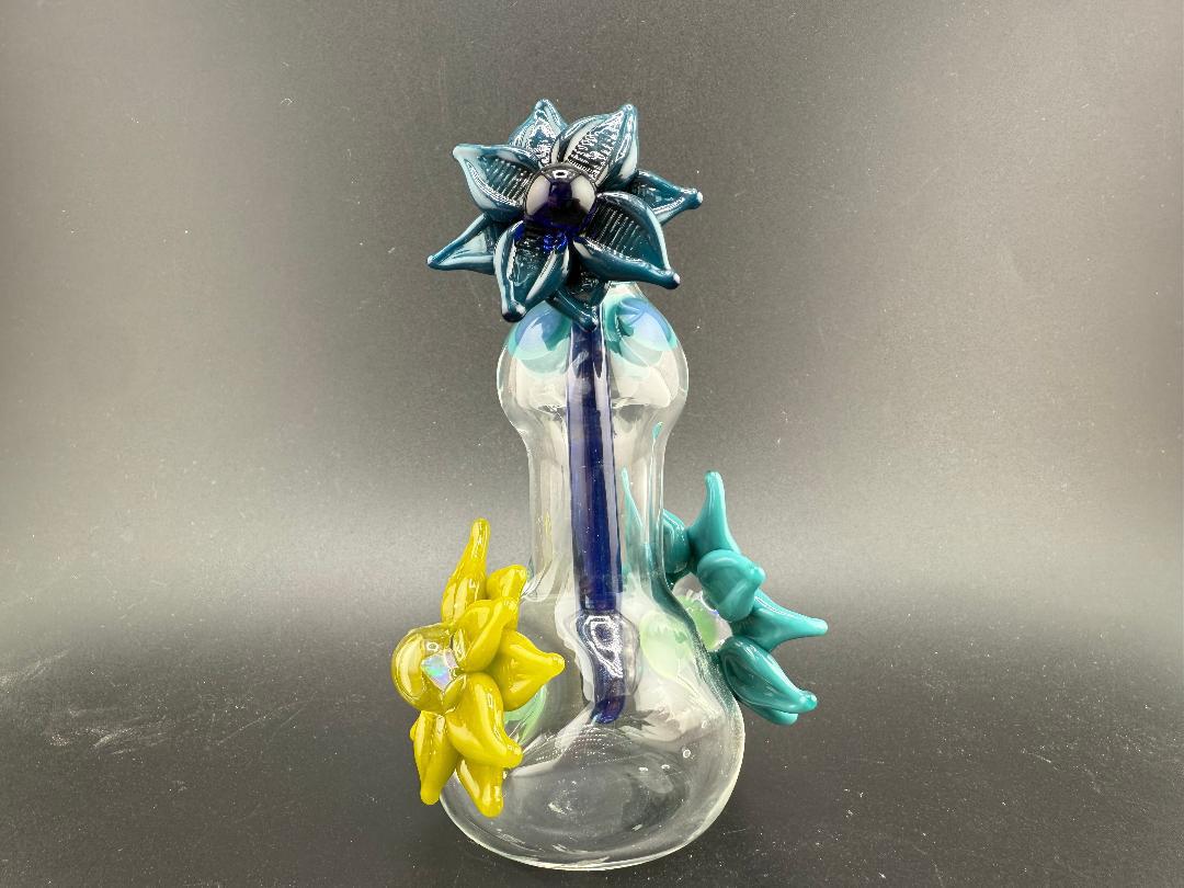 Pablos Glass Flower Jar featuring vibrant glass flowers in blue and yellow, perfect for decorative use.