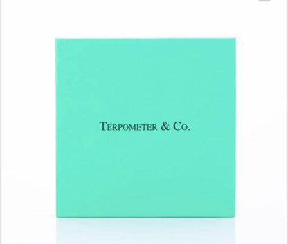 Terpometer IR thermometer packaging box in teal color with brand name Terpometer & Co.