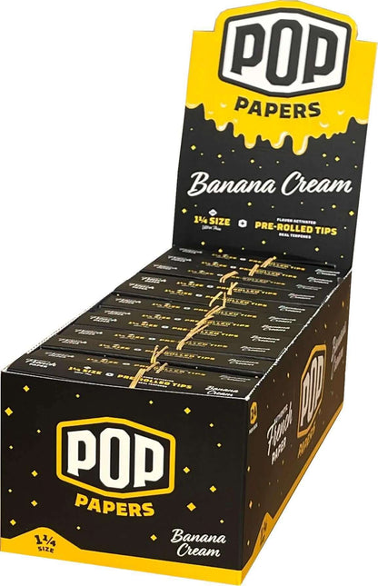 Pop Papers 1 1/4 size flavored rolling papers with pre-rolled terpenes, featuring Banana Cream flavor, displayed in a box.