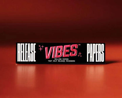 Vibes Release Papers King Size package on a solid color background, promoting social justice and slow-burning papers.