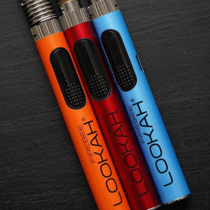 Lookah FIREBEE vaporizer pens in orange, red, and blue colors, showcasing a compact and stylish design for vaping.