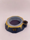 Focus V Carta 2 base stabilizer in blue and gold, featuring a Saber Hot Knife holder for enhanced dab station organization.