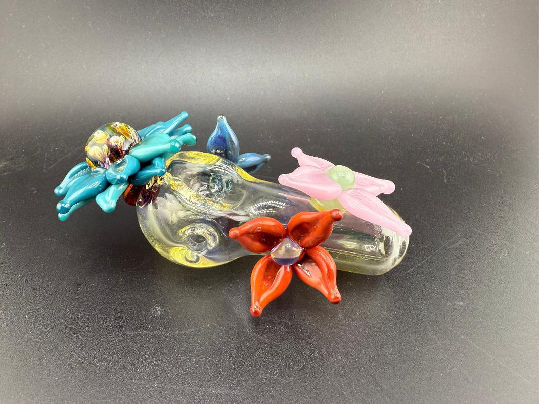 Pablos Glass Flower Hand Pipe featuring colorful floral designs, perfect for a unique smoking experience.