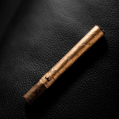 King Palm Vanilla Creme Flavor cone wrapped in 24K gold on a dark background.