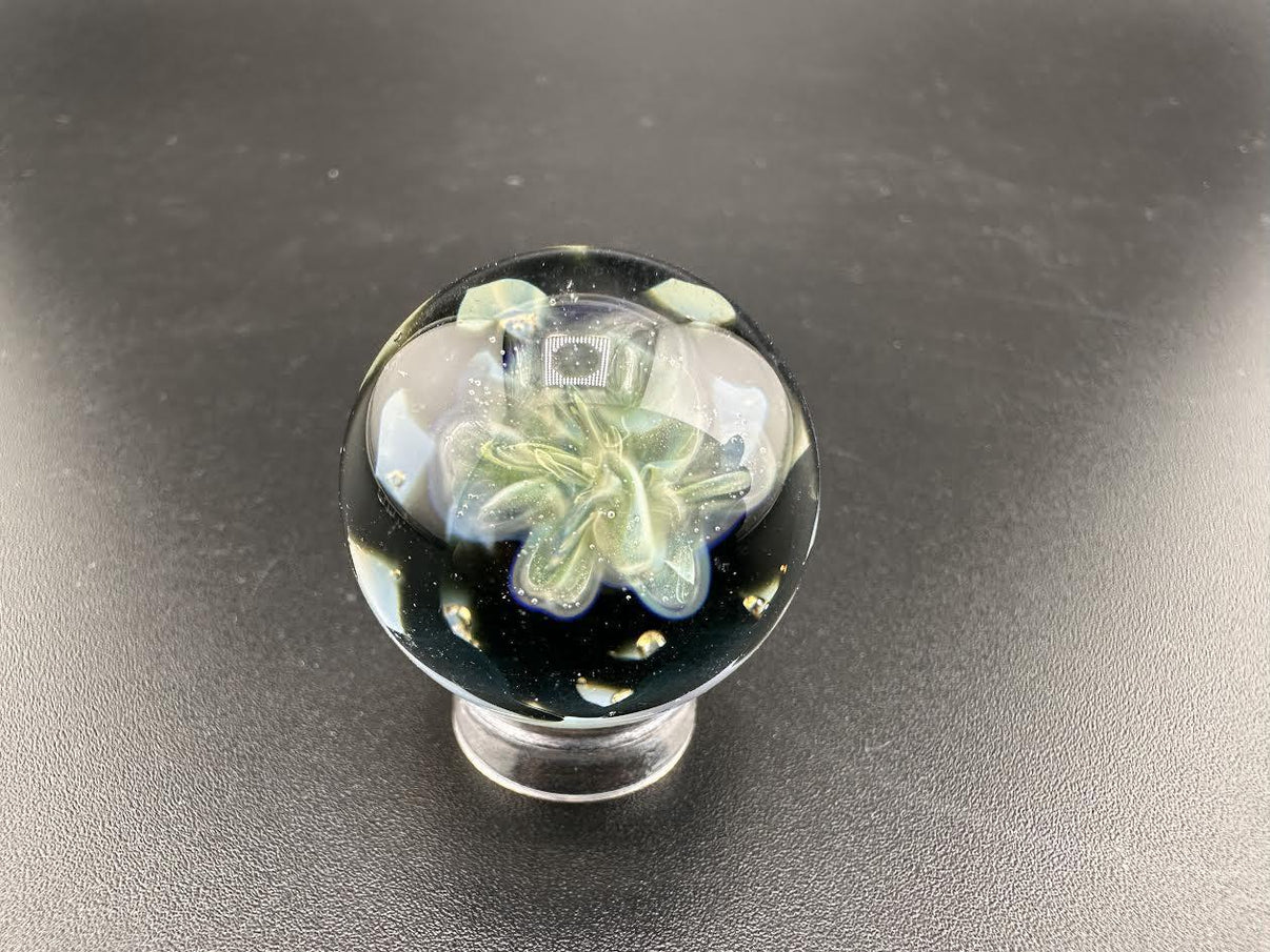 Elbow Tim Glass Fume Chaos Marble showcasing intricate colors and pattern in handcrafted glass art, approximately 1 inch in diameter.