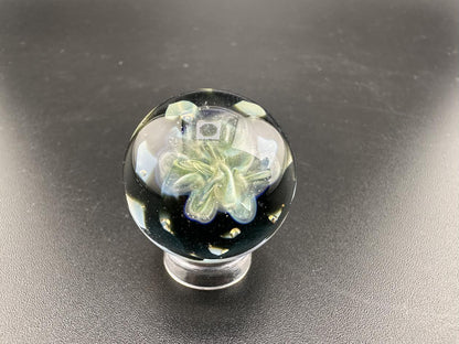 Elbow Tim Glass Fume Chaos Marble showcasing intricate colors and pattern in handcrafted glass art, approximately 1 inch in diameter.