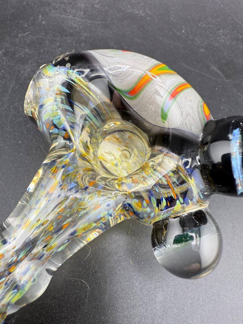 Elbow Tim Glass Hand Pipe - Fumed w/ Rainbow Wig wag Cap, Accents , & Marble Attachments close-up showing colorful details.