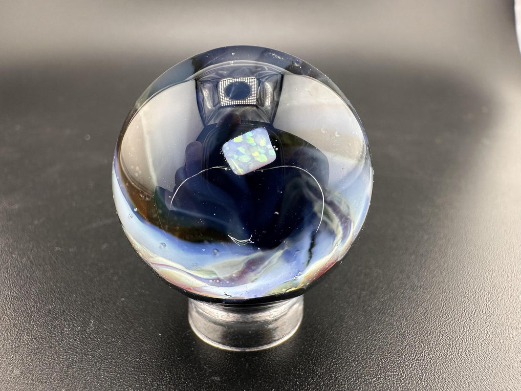 Elbow Tim Glass Marble - Opal Vortex showcasing a captivating vortex design and opal centerpiece.