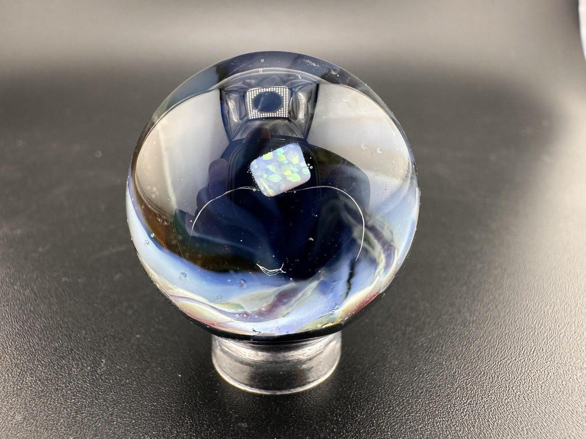 Elbow Tim Glass Marble - Opal Vortex showcasing a captivating vortex design and opal centerpiece.