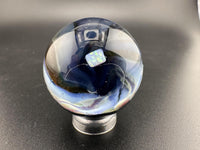 Elbow Tim Glass Marble - Opal Vortex showcasing a captivating vortex design and opal centerpiece.