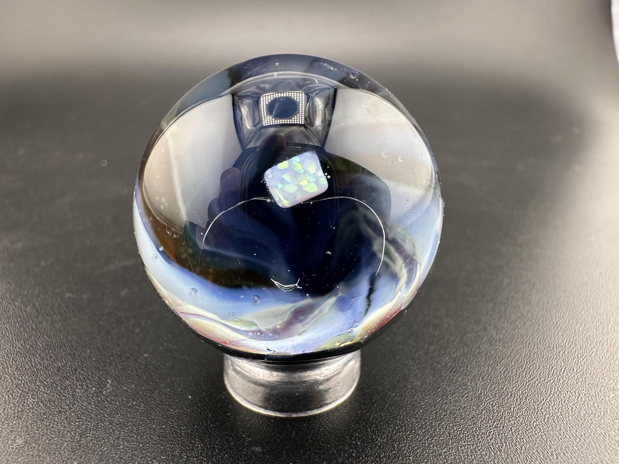 Elbow Tim Glass Marble - Opal Vortex showcasing a captivating vortex design and opal centerpiece.