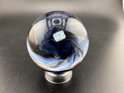 Elbow Tim Glass Marble - Opal Vortex showcasing a captivating vortex design and opal centerpiece.
