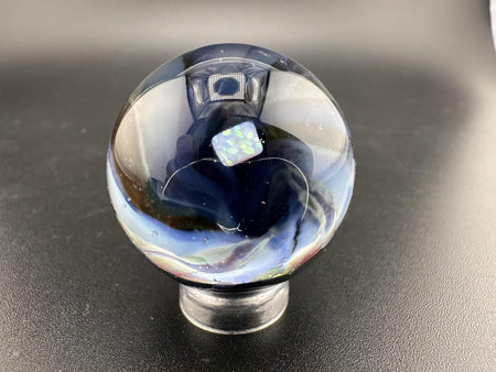 Elbow Tim Glass Marble - Opal Vortex showcasing a captivating vortex design and opal centerpiece.