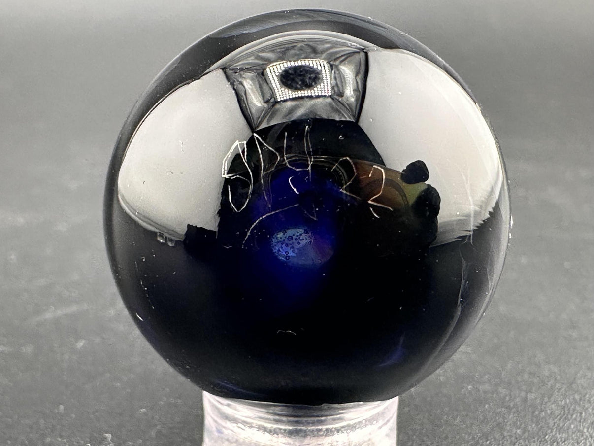 Elbow Tim Glass Marble - Opal Vortex featuring a mesmerizing vortex design and brilliant opal core.