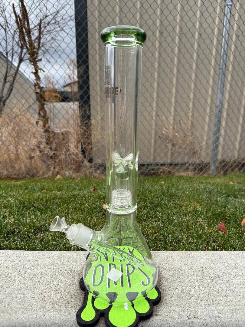 Encore Glass 16" Matrix Perk Beaker 14mm 90° on green mat background, showcasing stylish design and durability.