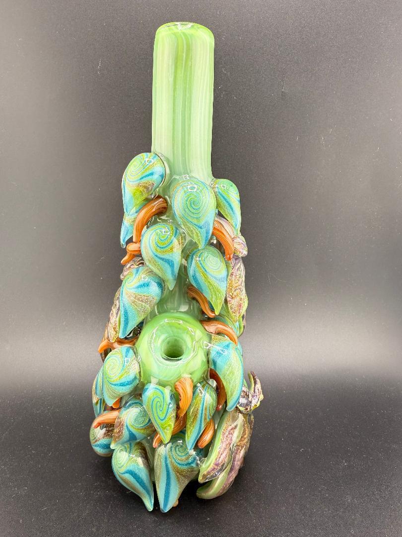 Mr. Gray glass dichroic leaf nug tube with intricate green and blue leaf designs, showcasing unique artistry.