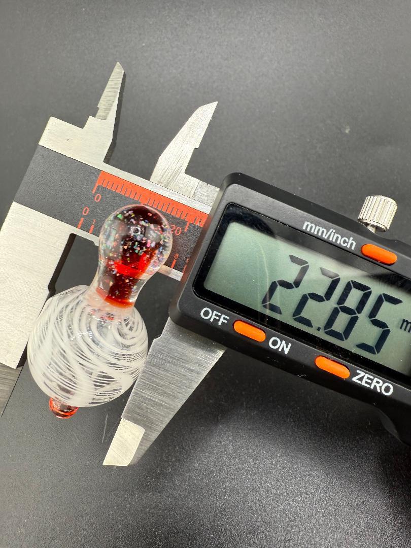 Paulson Pieces Bubble Cap with caliper measurement, showcasing the white and red Retticello design, measuring 22.85mm.