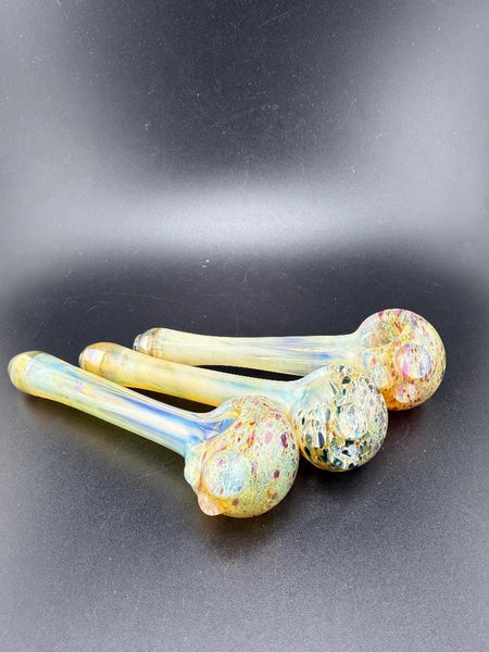 Three handmade fumed frit hand pipes featuring colorful glass designs, showcasing unique craftsmanship from Washington.