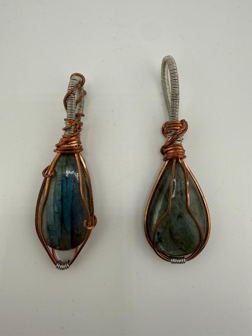 Handcrafted wire-wrapped labradorite pendants showcasing natural beauty and unique artistry.