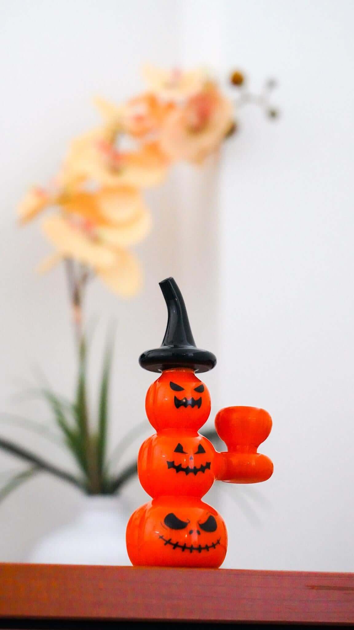 Toxic Pumpkin Bubbler TX104 in pumpkin shape with a witch hat, perfect for Halloween celebrations year-round.