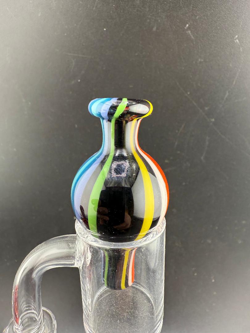 Filla John Line Worked Bubble Cap with colorful line work design for dabbing setup and improved airflow.