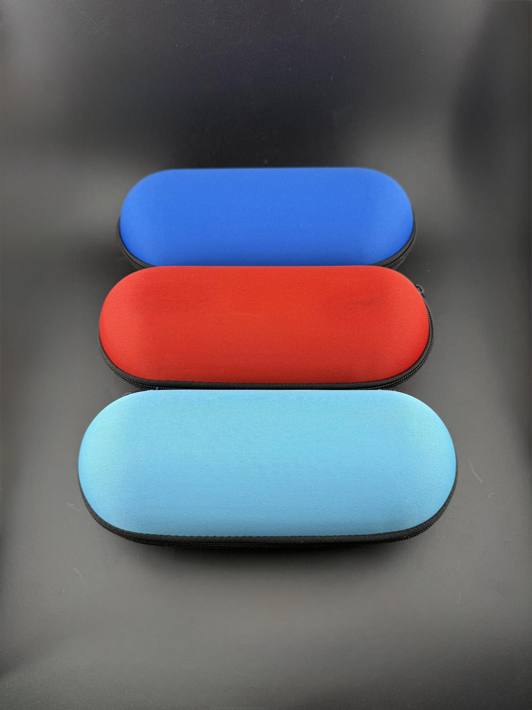 Pipe Case - Large in blue, red, and light blue colors arranged neatly for display.