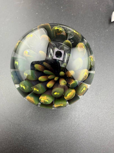 McDoogIe Glass Marble – 40mm Gold Fume Implosion showcasing vibrant colors and detailed implosion pattern.