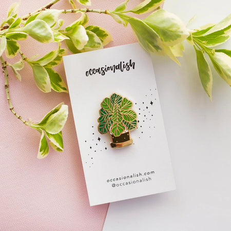 Occasionalish Enamel Pin - Fiddle Leaf Fig displayed with leafy background on a card.