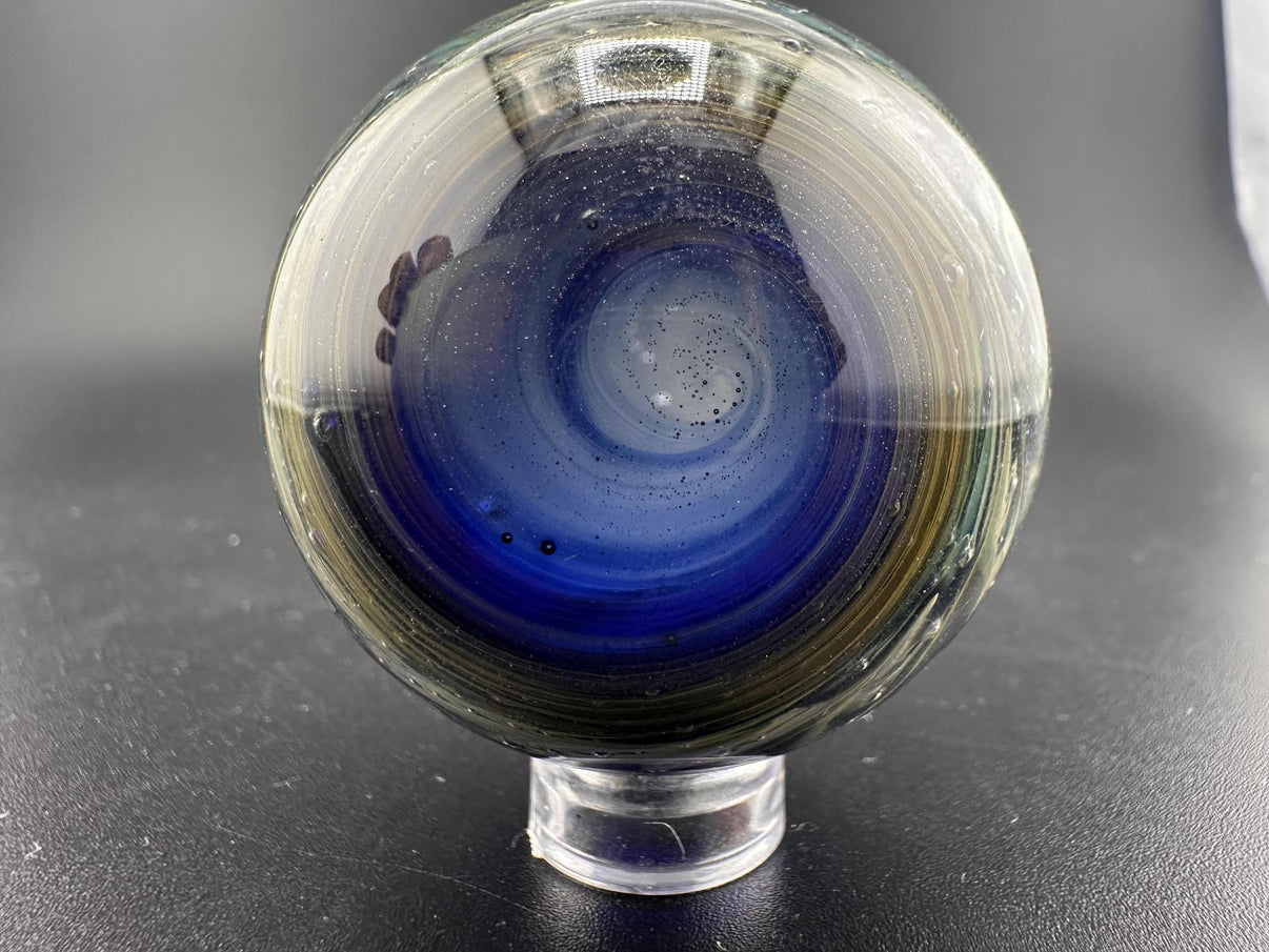Filla John Glass Big Marble - Sparkled Swirls UV showcasing intricate swirling patterns and UV-reactive elements.