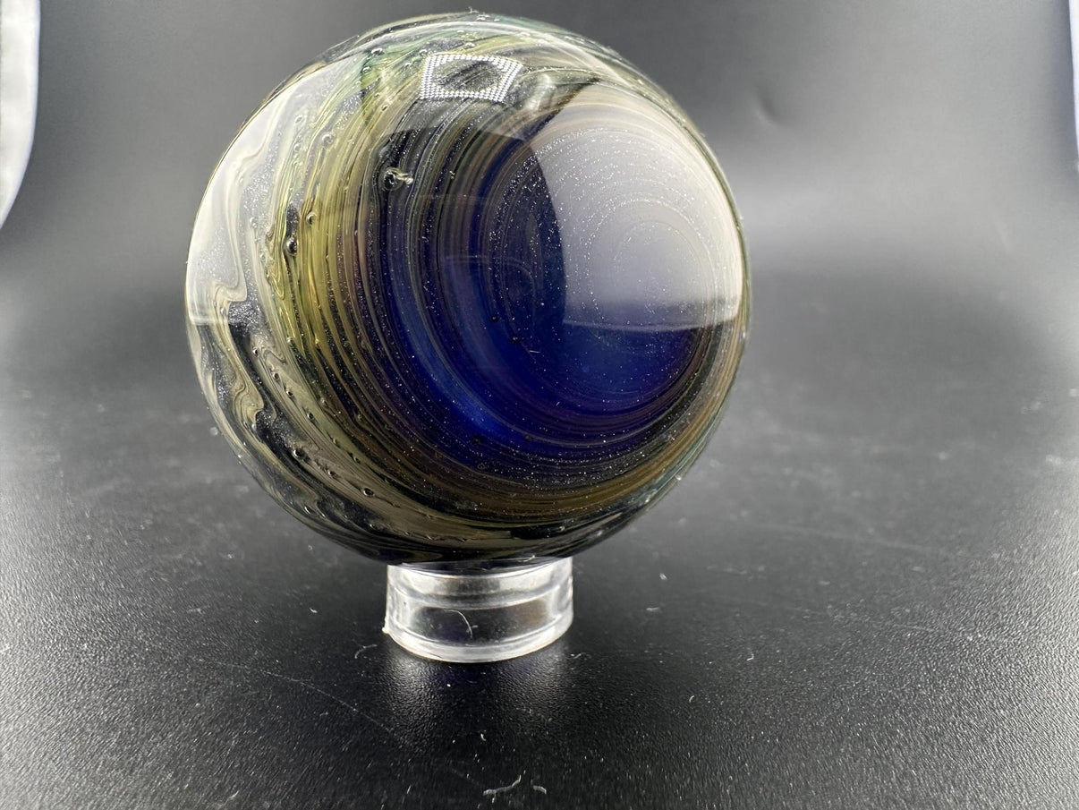 Filla John Glass Big Marble - Sparkled Swirls UV showcasing intricate swirling patterns and sparkling details.