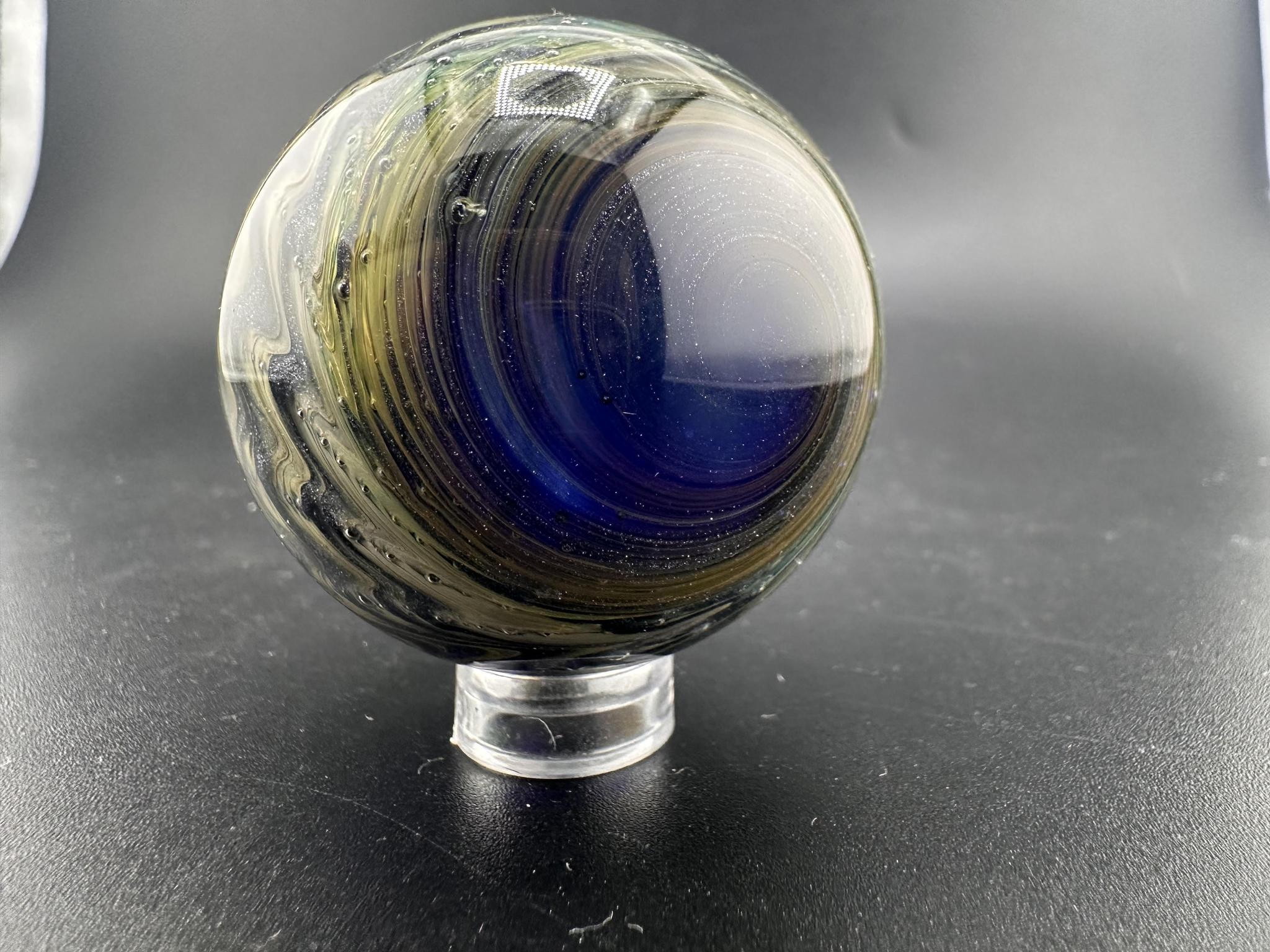 Filla John Glass Big Marble - Sparkled Swirls UV showcasing intricate swirling patterns and sparkling details.