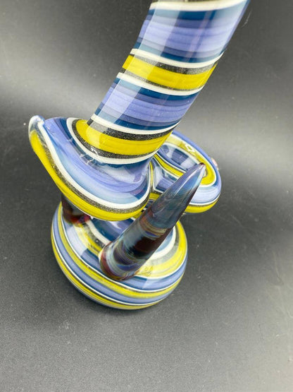 Filla John Glass Bubbler - Purple & yellow Line Worked w/ Horn & Dichro Marble Attachment close-up view.