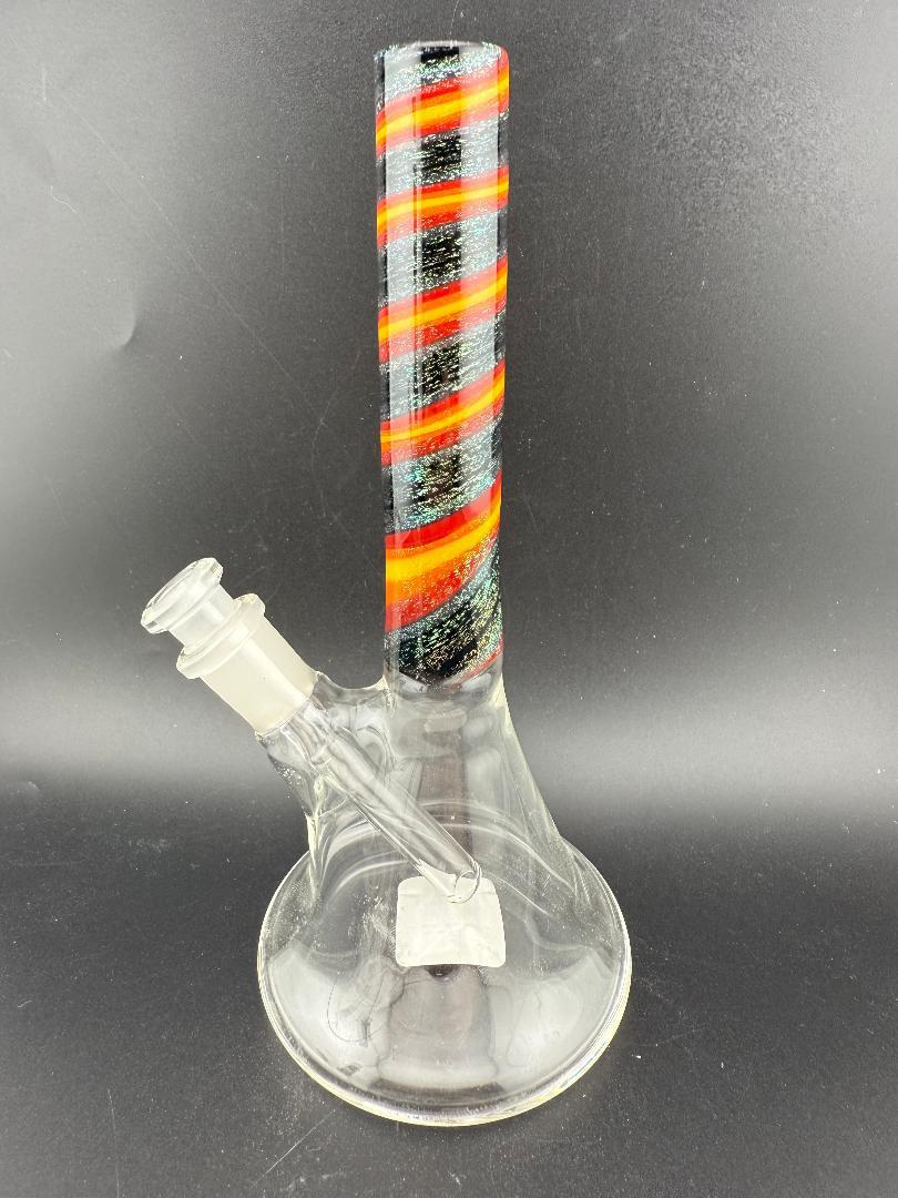 Filla John Glass Dichro Beaker 10mm 45° with colorful striped neck and clear body displayed on black background.