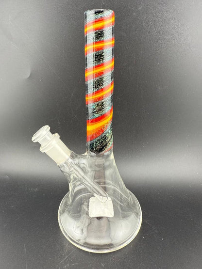 Filla John Glass Dichro Beaker 10mm 45° with colorful striped neck and clear body displayed on black background.