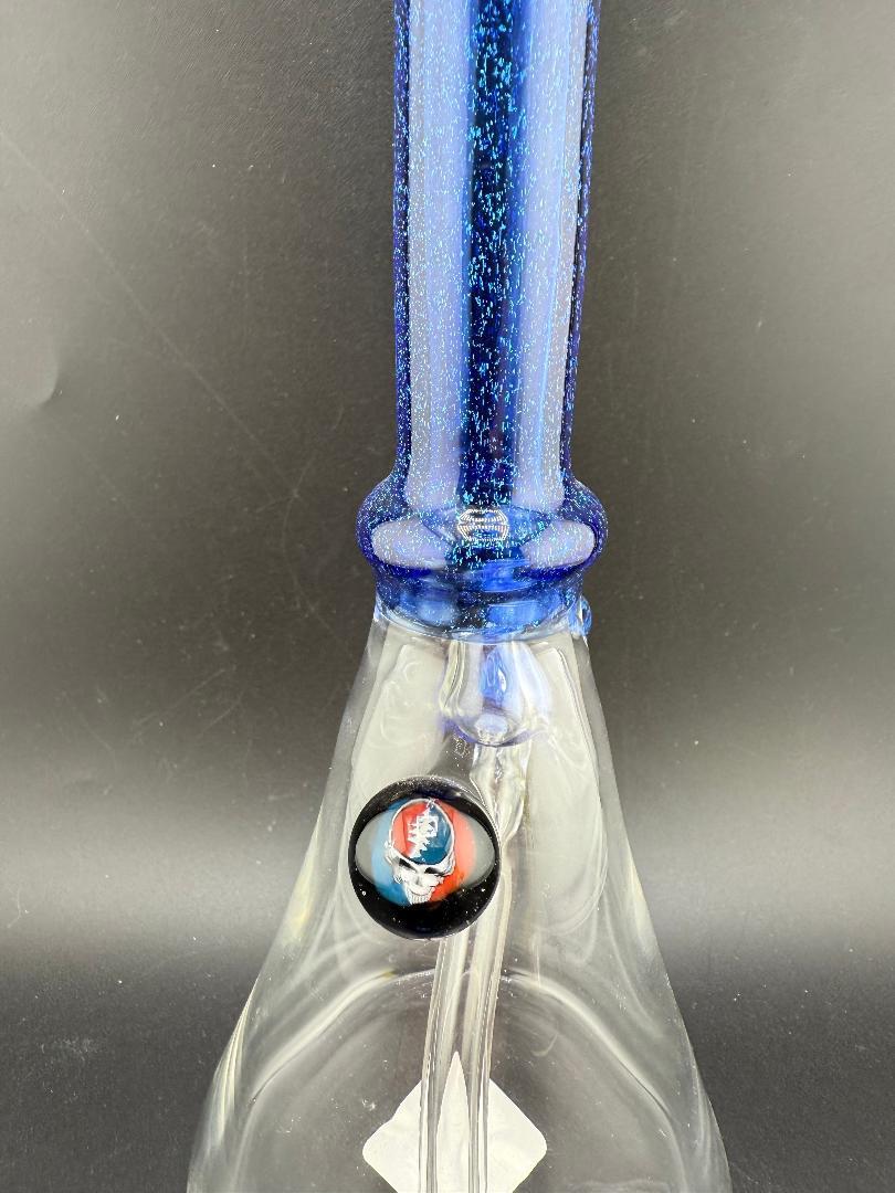Filla John Glass Dichro Neck Single Color Beaker 10mm 45° with vibrant blue neck and decorative marbles.