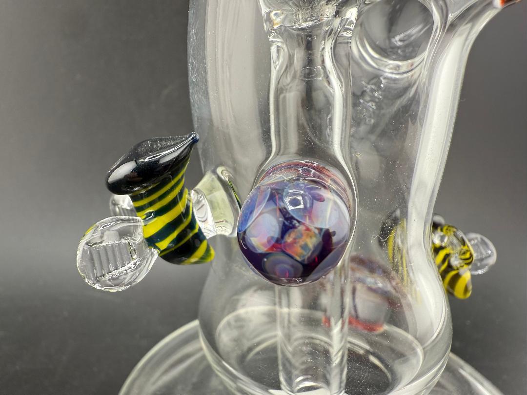 Filla John Glass Flower Bubbler – Clear w/ Amber Purple Marbles & Bee Attachments with artistic details.