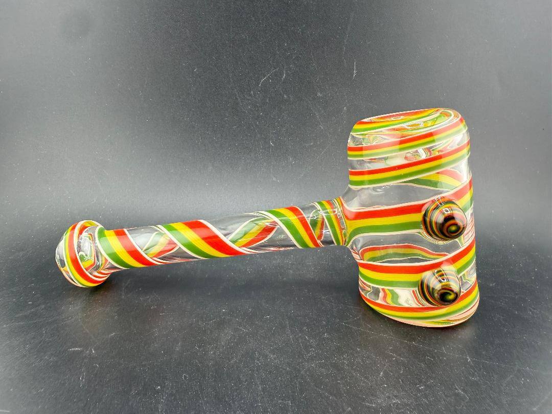 Filla John Glass Hammer Pipe - Rasta Line Work with vibrant Rasta-inspired line work on borosilicate glass.