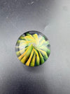 Filla John Glass Marble - Fumed Implosion Approx. 1.25" showcasing a vibrant spiral design in layered colors.