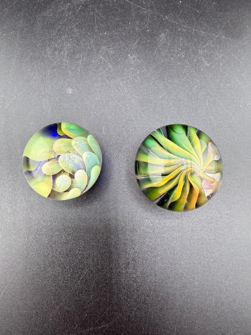 Filla John Glass Marble - Fumed Implosion Approx. 1.25" showcasing vibrant colors and intricate designs.