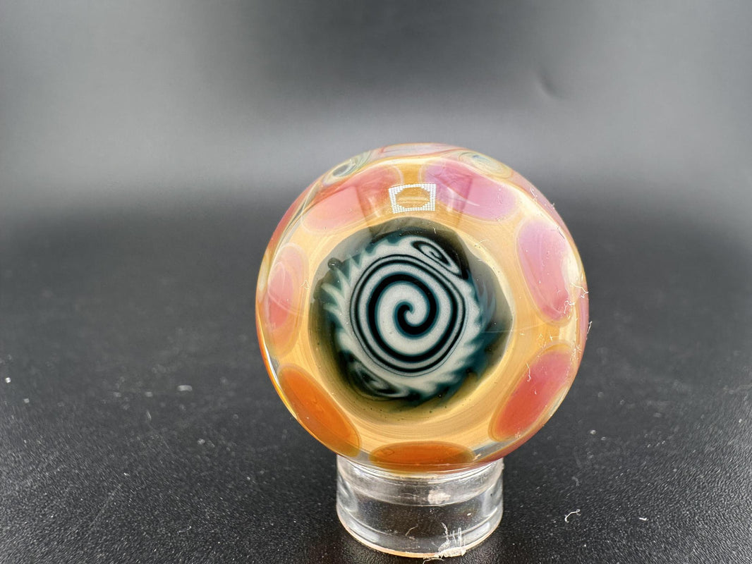 Filla John Glass Millie Marble – 1 inch intricate millie art glass with colorful patterns and detailed design.