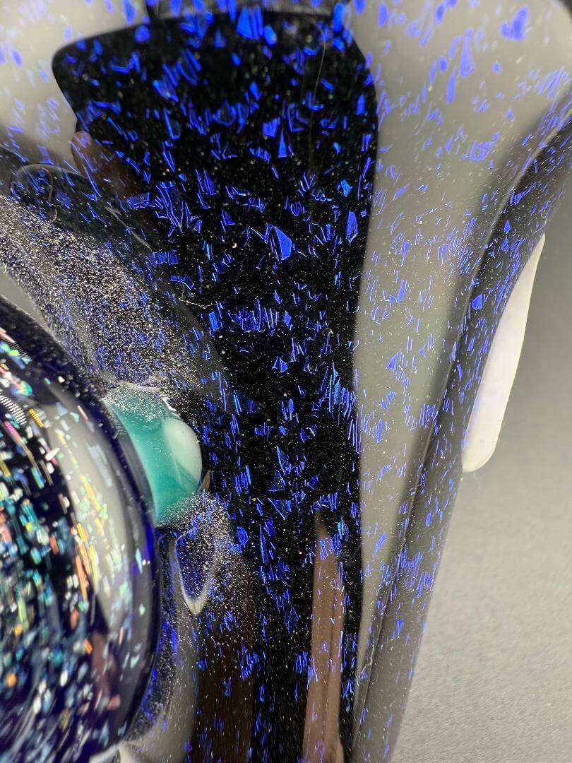 Filla John Glass Sherlock Pipe - Blue Dichro w/ Dichro Pendant Attachment close-up showcasing its shimmering blue dichroic detail.