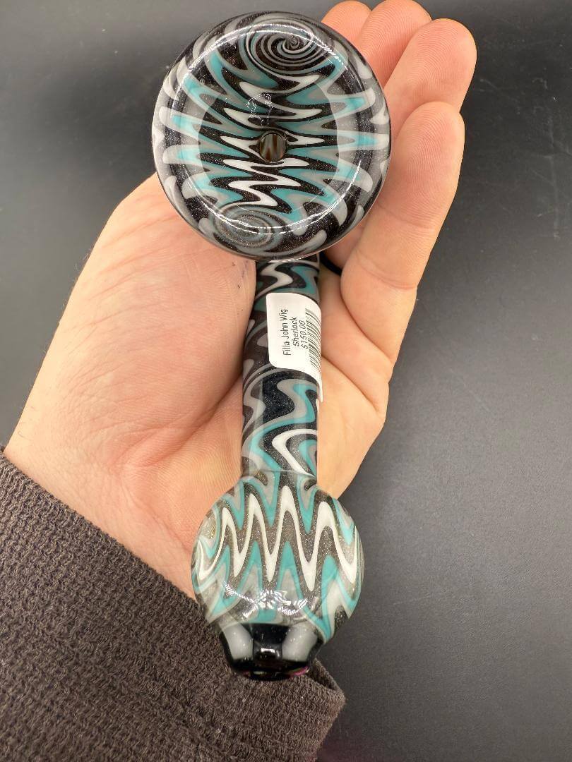 Filla John Glass Sherlock Pipe - Teal, Grey & Black with Dichro Accents in hand, showcasing intricate colorwork.