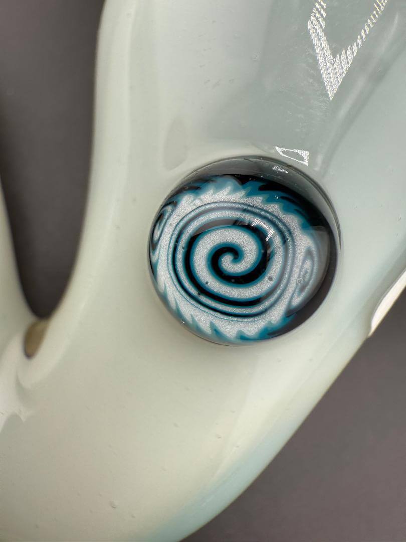 Close-up of Filla John Glass Sherlock Pipe - White w/ Millie Attachment showing detailed millie decoration.